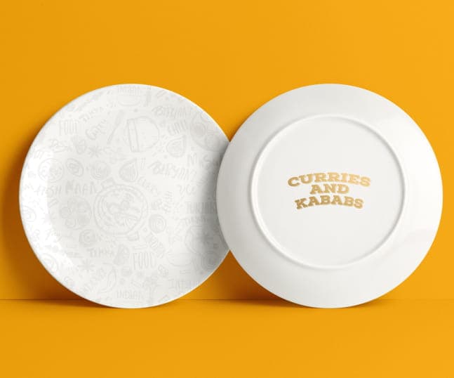 White crockery plates with branded logo