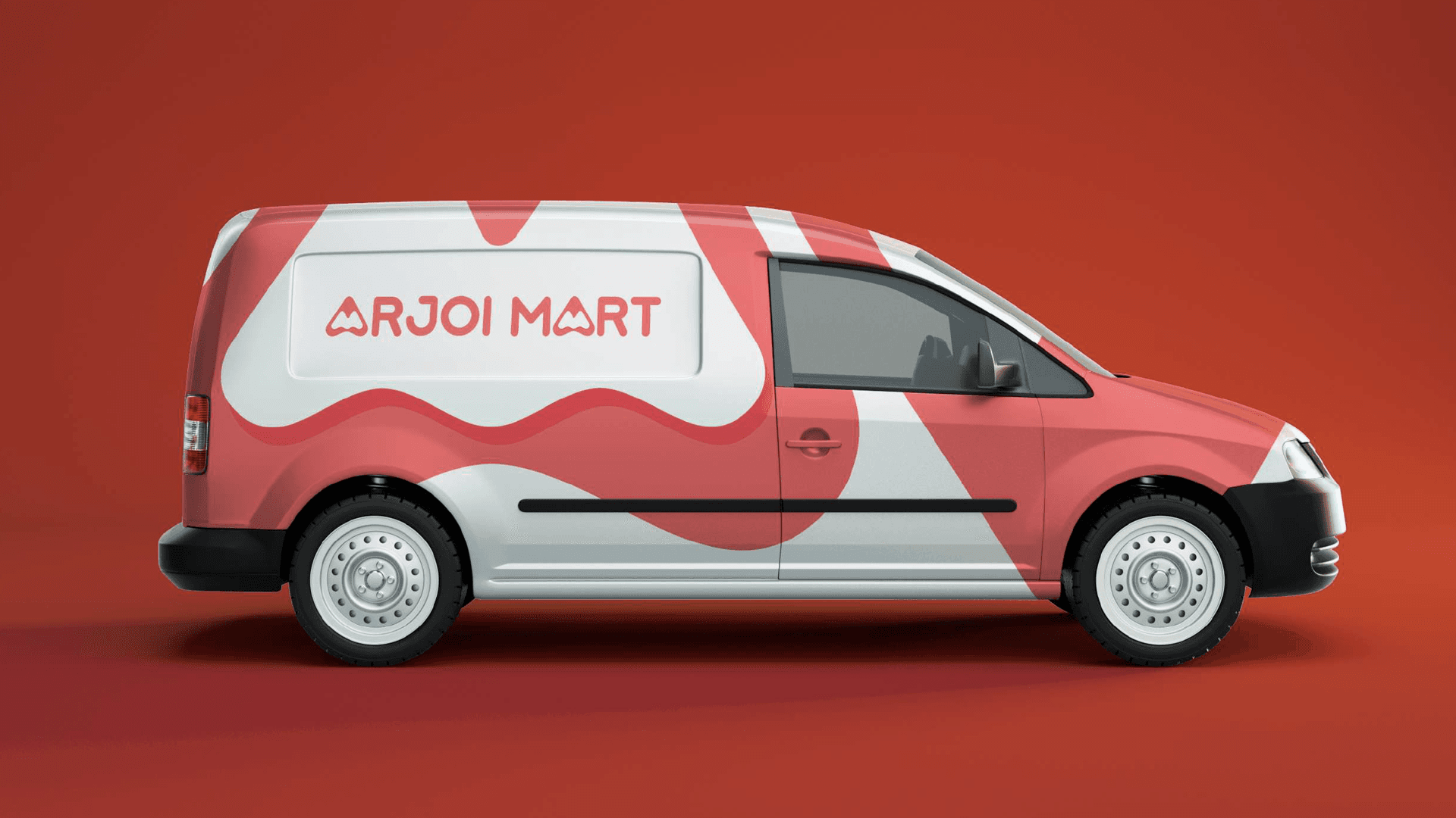 Arjoi Mart delivery van wrap — red and white brand pattern on compact van, side profile on red background