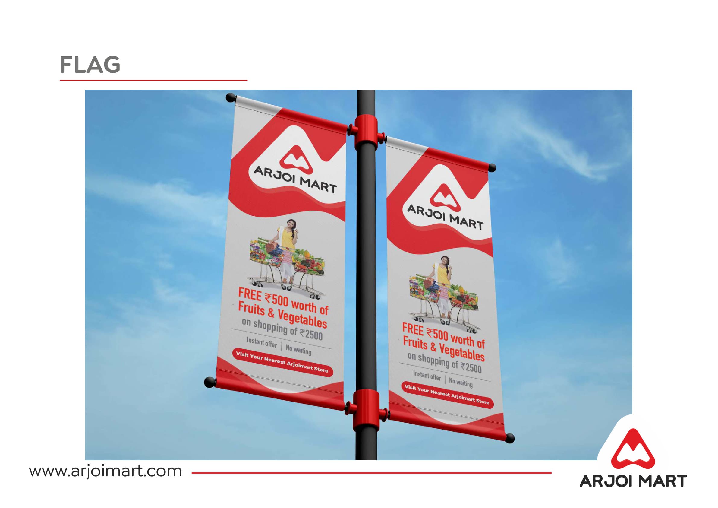 Arjoi Mart street pole flags — two double-sided banners on pole against blue sky, Sabse Bada Offer campaign